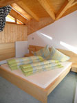 1. Schlafzimmer in Ferienwohnung Dach der Alpen